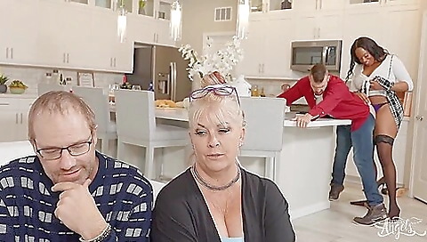 Busty ebony takes on a big cock from behind and facial